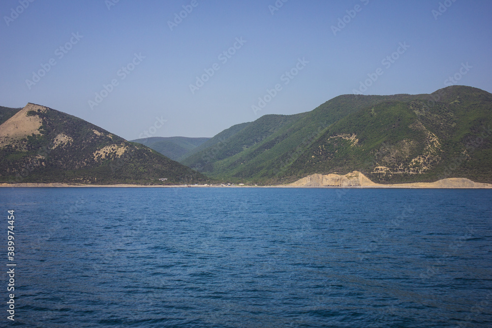 Republic of Crimea, Balaklava city Sea in the morning and mountains illuminated by the sun. Black Sea. Republic of Crimea, Balaklava city Sea in the morning and mountains illuminated by the sun. Black Sea.