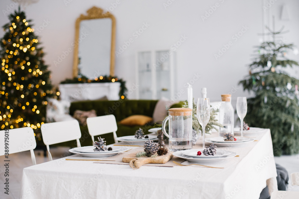 Beautiful served table with decorationsand lanterns. Living room decorated with lights and Christmas tree. Holiday setting Beautiful served table with decorationsand lanterns. Living room decorated with lights and Christmas tree. Holiday setting