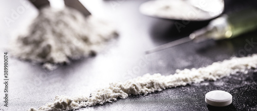 Obraz na plátně cocaine and heroin on dark wooden table, concept of addiction and chemical depen