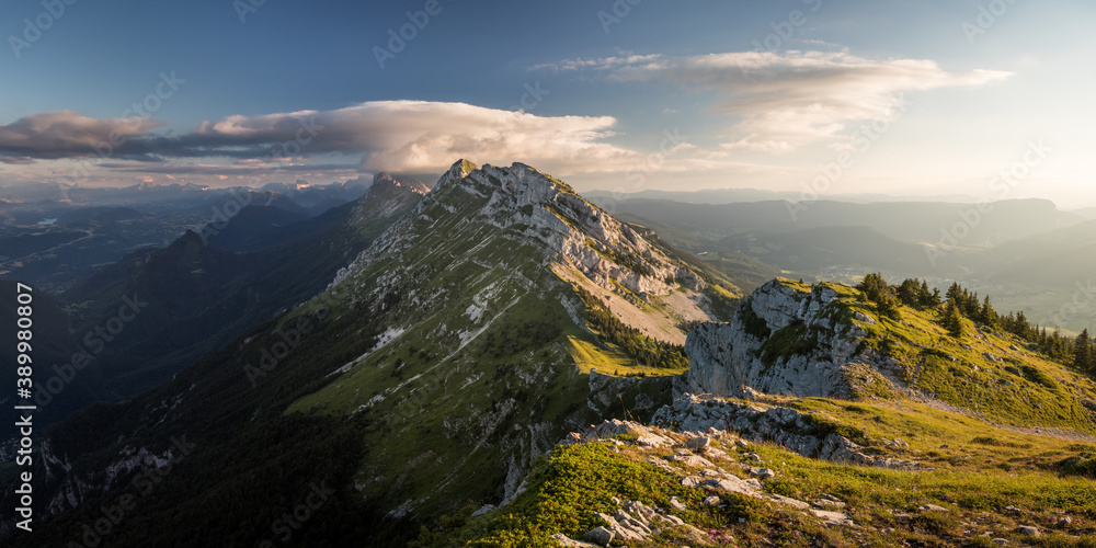 Panoramic view of vercors mountain range with clouds and sunset in summer