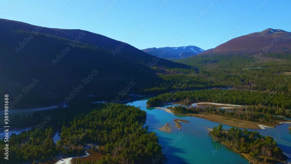 Wild mountain landscape with boreal pine forest and glacial rivers. Wild mountain landscape with boreal pine forest and glacial rivers.
