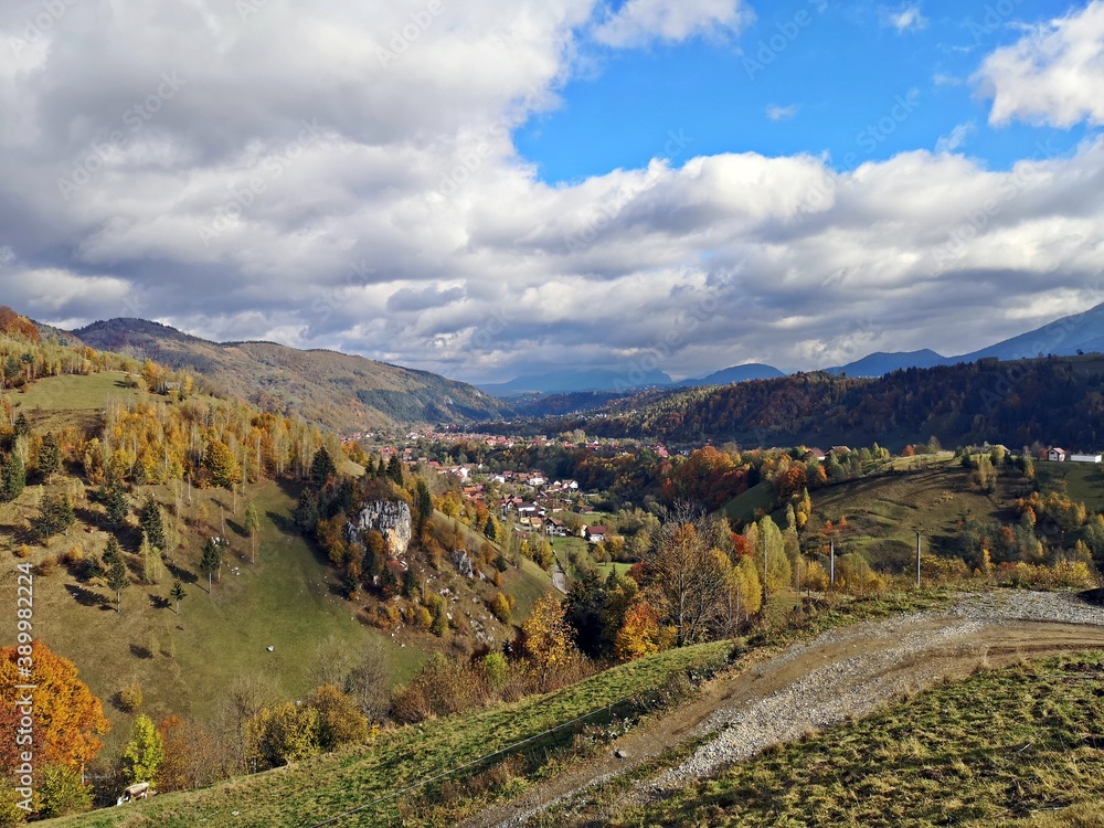 Amazing mountains landscape during fall season. Small village in the mountains. Rural landscape.