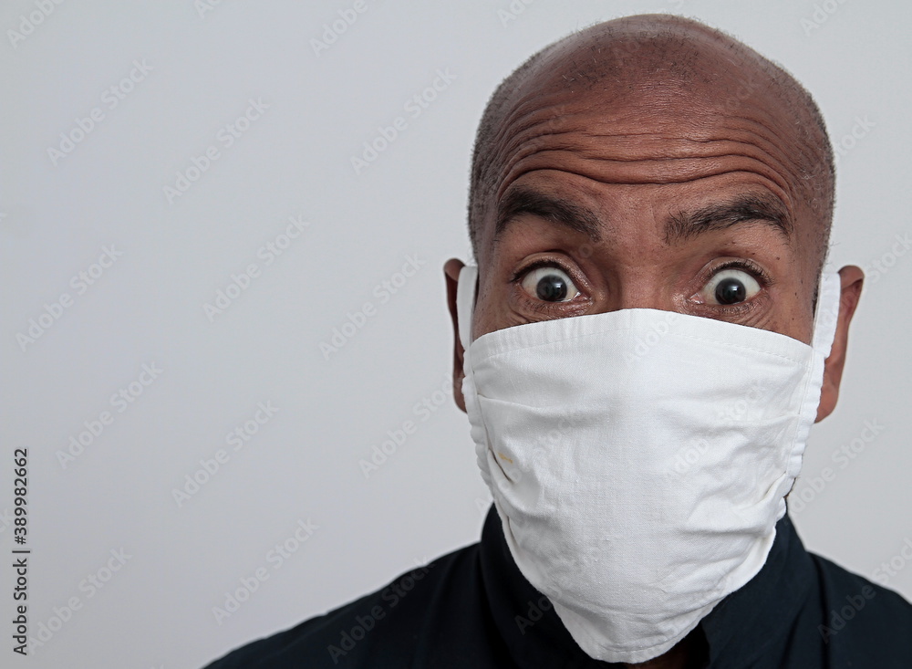 man with dust mask fighting the Coronavirus pandemic outbreak on grey background stock photo man with dust mask fighting the Coronavirus pandemic outbreak on grey background stock photo