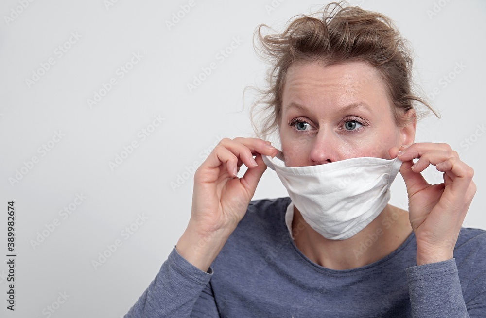 woman with face mask protecting herself from coronavirus on white background stock photo woman with face mask protecting herself from coronavirus on white background stock photo
