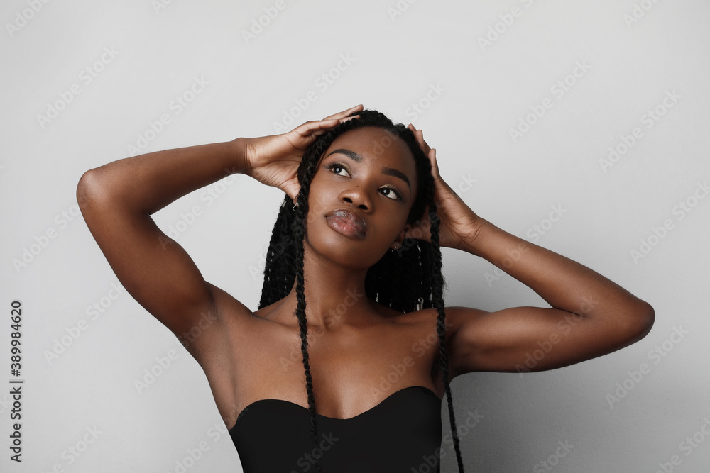 Beauty black skin woman. Young african american model with long hair. Isolated. Beauty black skin woman. Young african american model with long hair. Isolated.