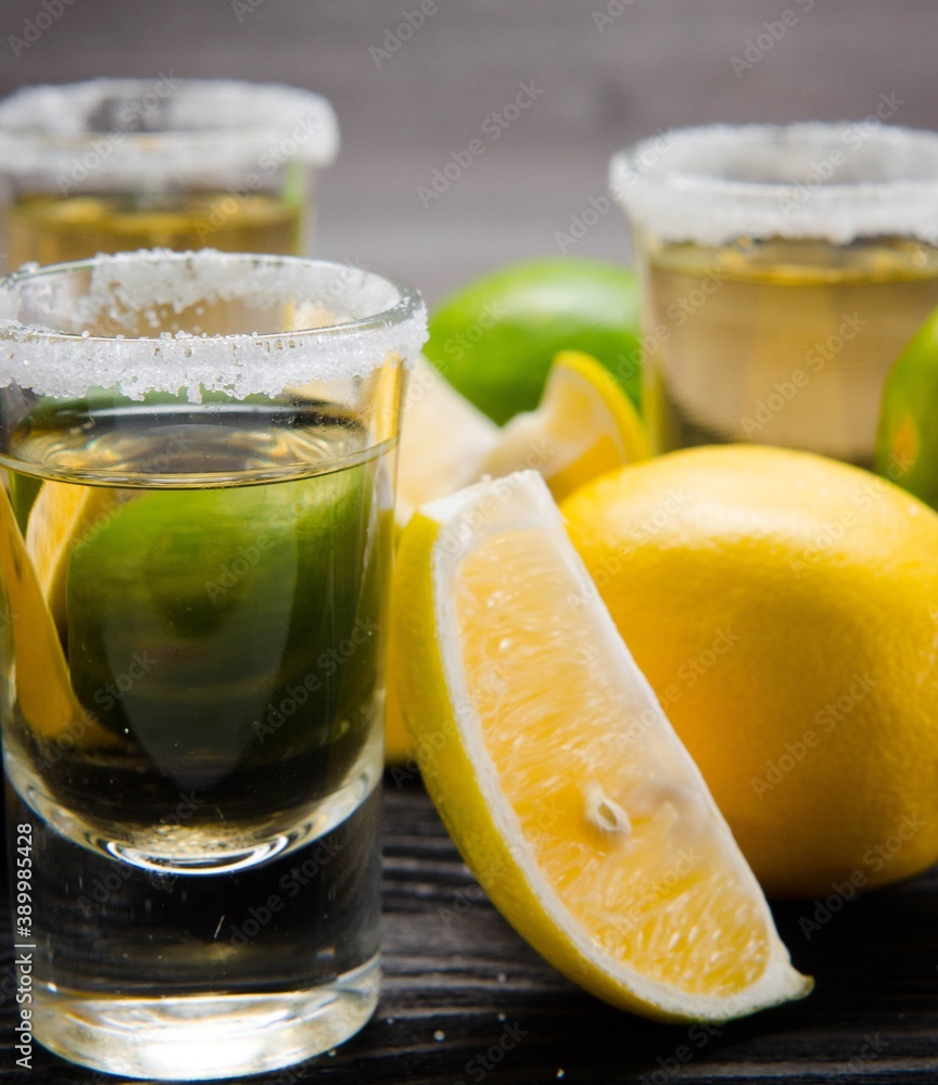 Tequila drink served in glasses with lime and salt Tequila drink served in glasses with lime and salt