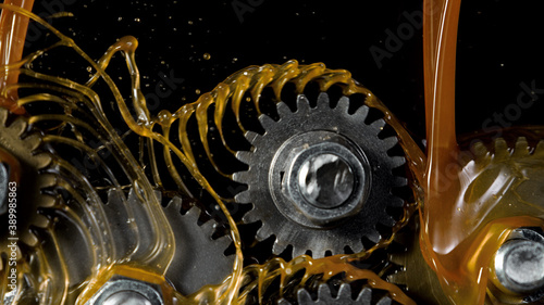 Tooth gear wheel with oil splashes photo