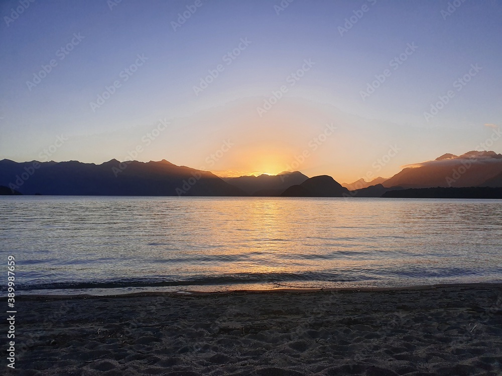 sunset over the lake
Lake Manapouri New Zealand 
Kepler