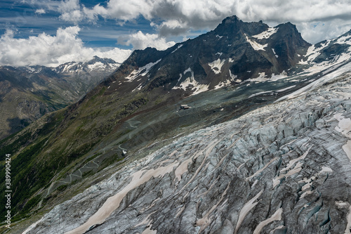 Mittaghorn 3143m and Egginer 3367m peaks, moraine and terminus of melting Fee glacier from Spielboden, Saaf-Fee, Valais, Switzerland photo