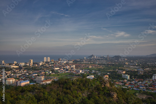 This unique photo shows the sunset in late October over the Thai seaside town called Hua Hin. you can see the houses and mountains very well.