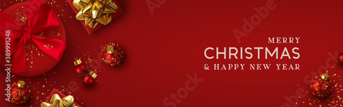 Christmas banner. Background Xmas design of realistic red gift box, 3d render bauble ball and glitter gold confetti. Horizontal christmas poster, greeting card, headers for website
