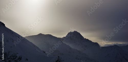 Snowy weather creating a dark and mystical mood in the ski area Fellhorn-Kanzelwand ath the border between Gemrany and Austria