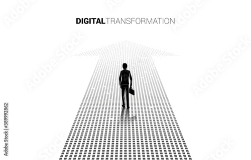 Silhouette of businessman standing on the arrow from pixel. concept of digital transformation of business.