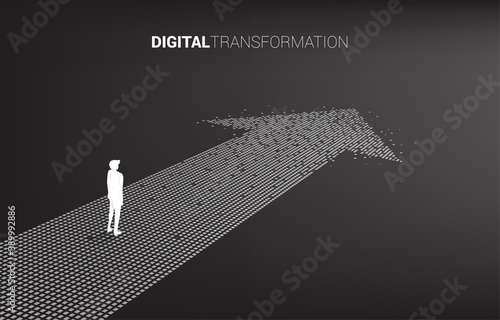 Silhouette of businessman standing on the arrow from pixel. concept of digital transformation of business.