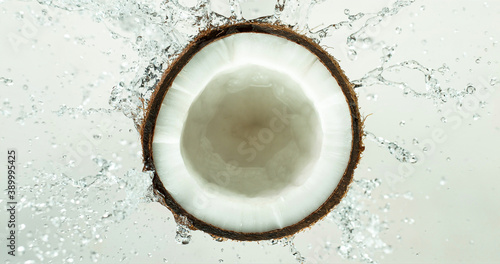 Freeze Motion Shot of Milk Splashing on Coconut, close-up