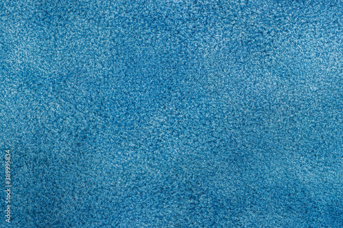 Texture of suede leather, genuine leather, blue color. Manufacturing and leather industry concept, background, copy space
