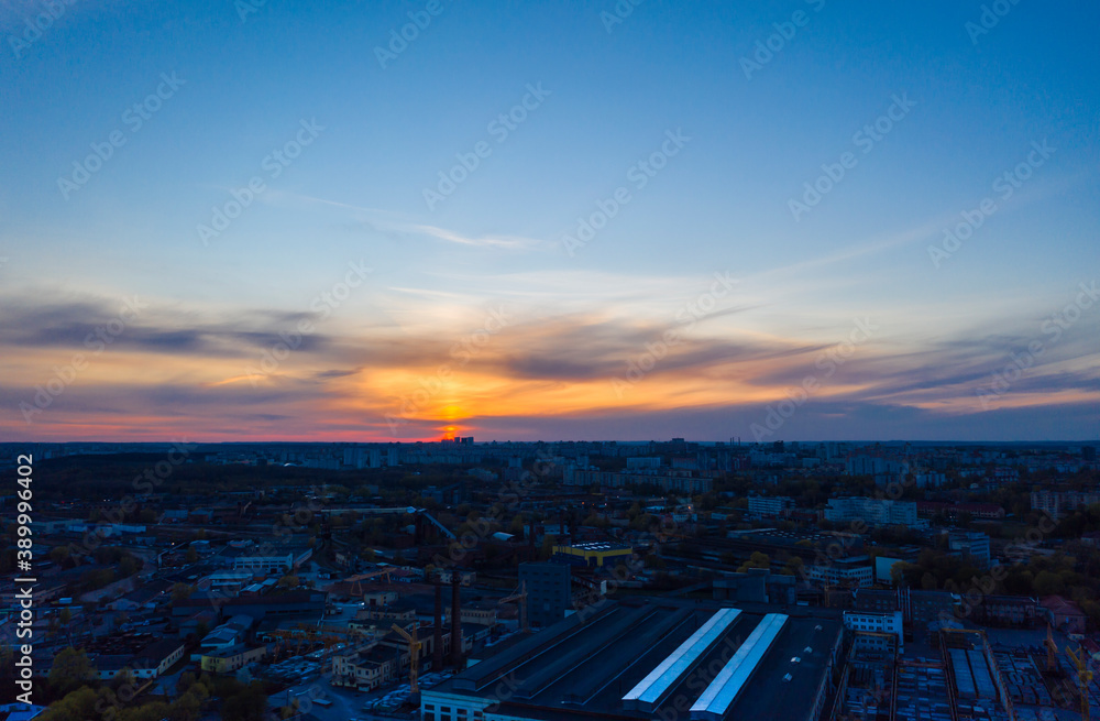 Sunset over an industrial area of the city