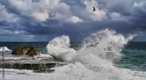 Fototapeta Naklejka Na Ścianę i Meble -  Stormy weather at sea. Strong waves hitting stones. Strong explosions from the waves of the sea.