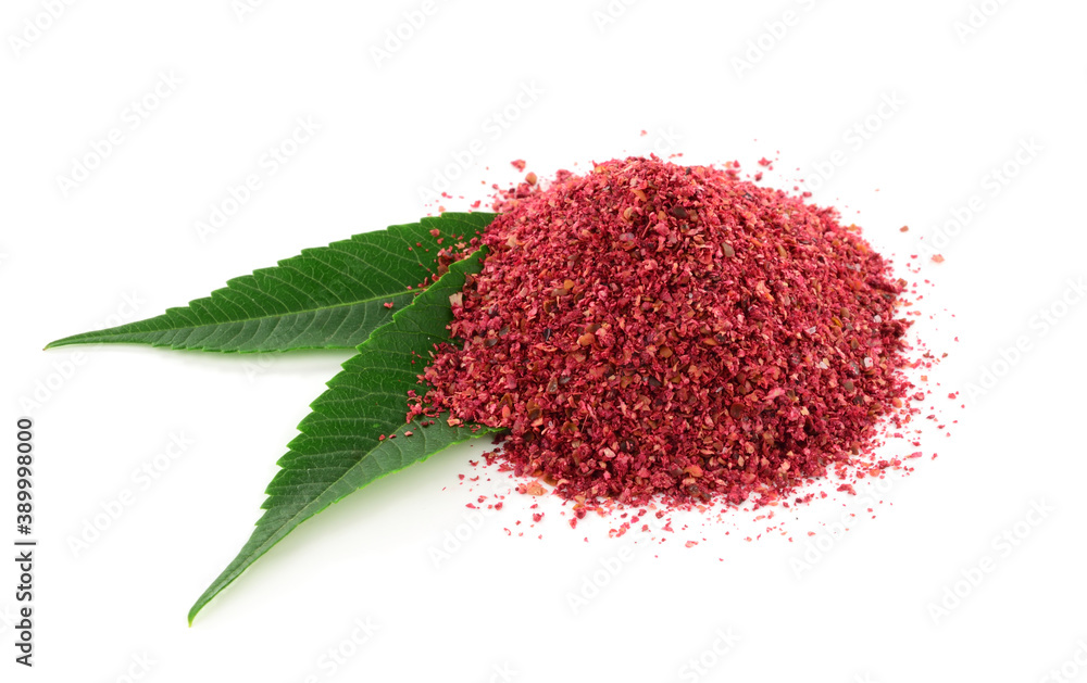Ground Sumac Powder Spice with Leaves. Isolated on White Background