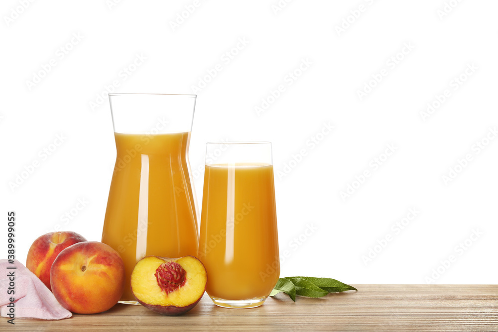 Freshly made tasty peach juice on wooden table against white background Freshly made tasty peach juice on wooden table against white background
