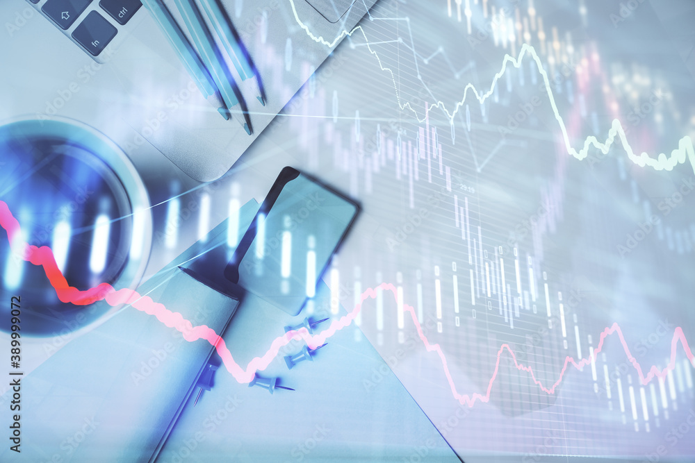 Double exposure of forex graph drawing over desktop background with computer. Concept of financial analysis. Top view. Double exposure of forex graph drawing over desktop background with computer. Concept of financial analysis. Top view.