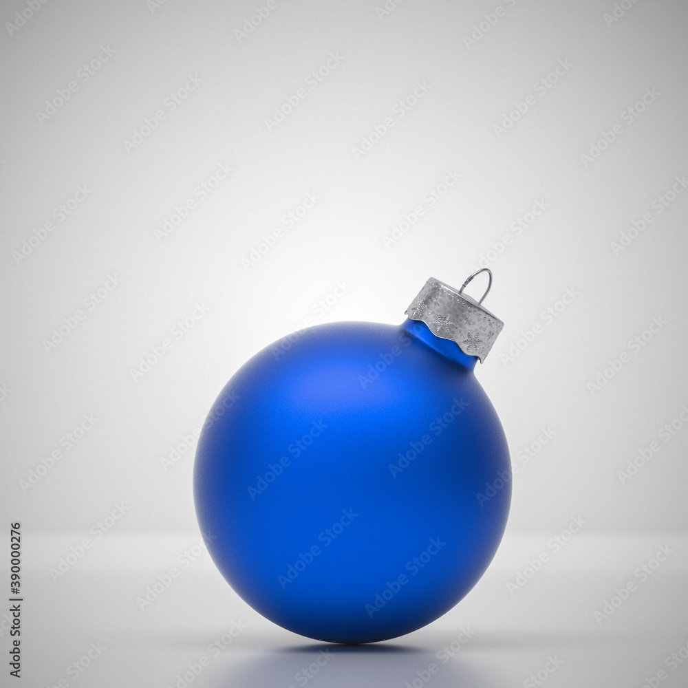 Light blue round matt Christmas ball. Christmas ornament standing on blue background.