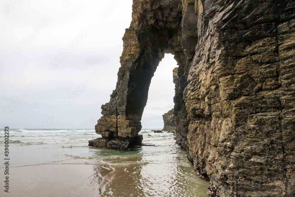 Rocky arch on the coast of Playa de las Catedrales in Lugo Spain 