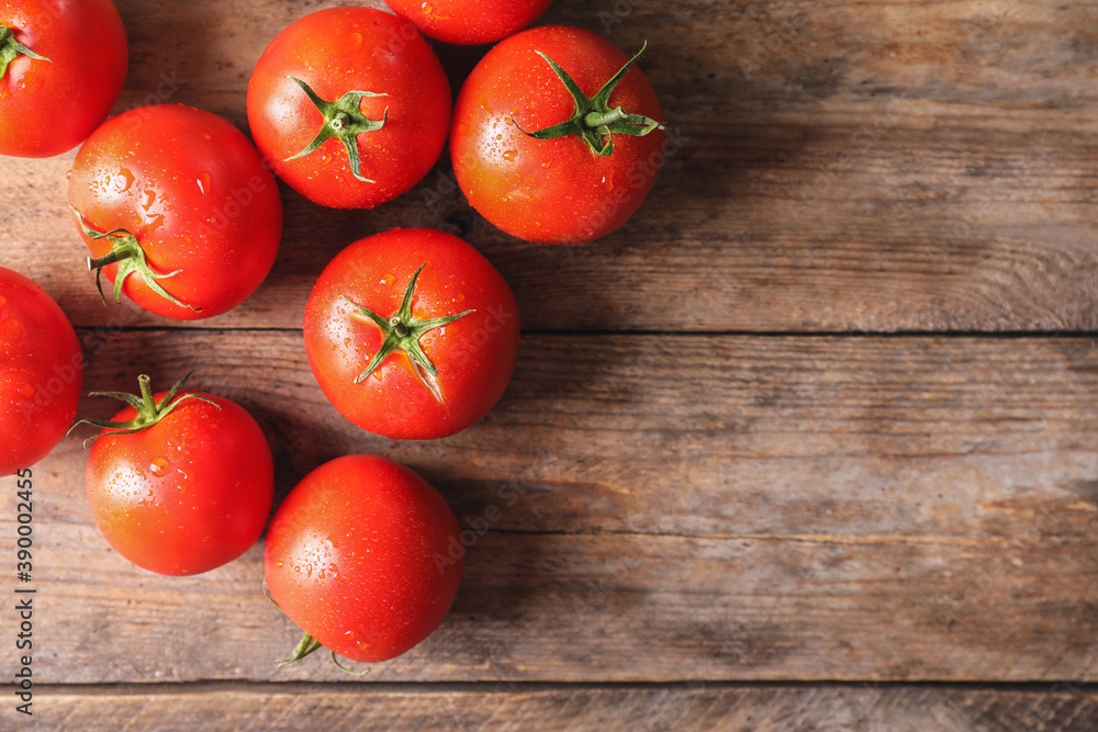 Fresh ripe tomatoes on wooden table, flat lay. Space for text Fresh ripe tomatoes on wooden table, flat lay. Space for text