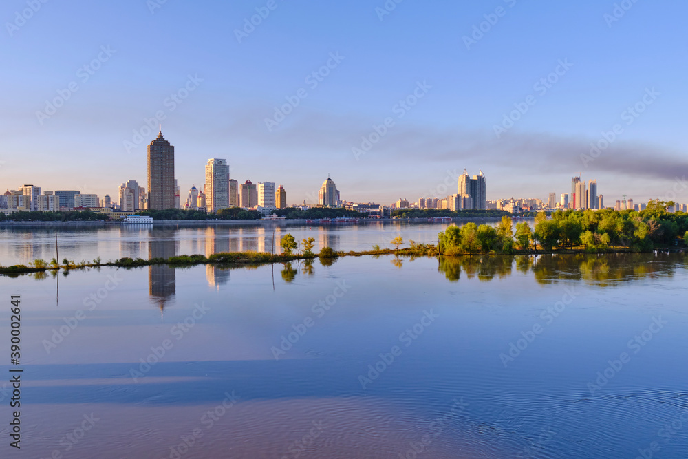A view of skyscrapers on the banks of the Songhua River in Harbin, China