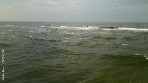 The Big Waves Of The Deep Ocean In Wladyslawowo Poland Splashing Everywhere In The Area During Daytime - Aerial Shot 