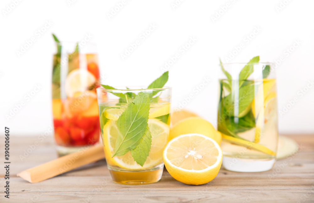 Fototapeta premium Summer mint lemon tea with a fan and cut lemon fruit