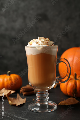 Delicious pumpkin latte on black slate table, closeup