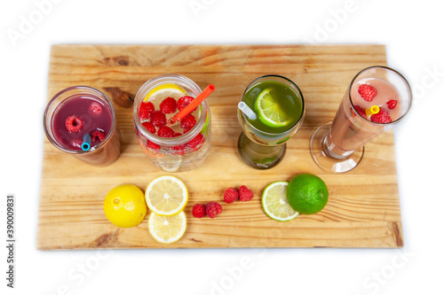 A serving platter with four drinks and smoothies lined up using food-grade, silicone straws that are reusable, and a plastic alternative to be sustainable photo