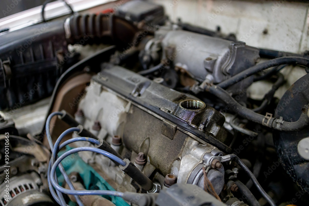 close up view for a dirty fuel car engine at auto repair service. engine maintenance concept close up view for a dirty fuel car engine at auto repair service. engine maintenance concept