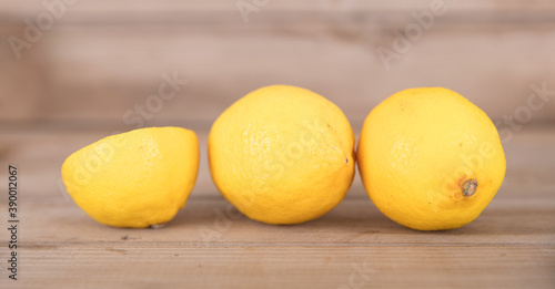 Two fresh lemons and half a cut lemon