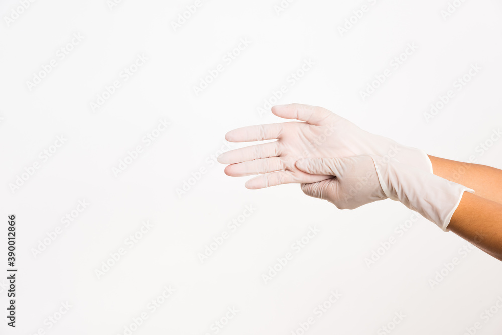 Woman wearing and putting hand to white rubber latex surgical medical glove for doctor, studio shot isolated on white background, Hospital medical infection control concept