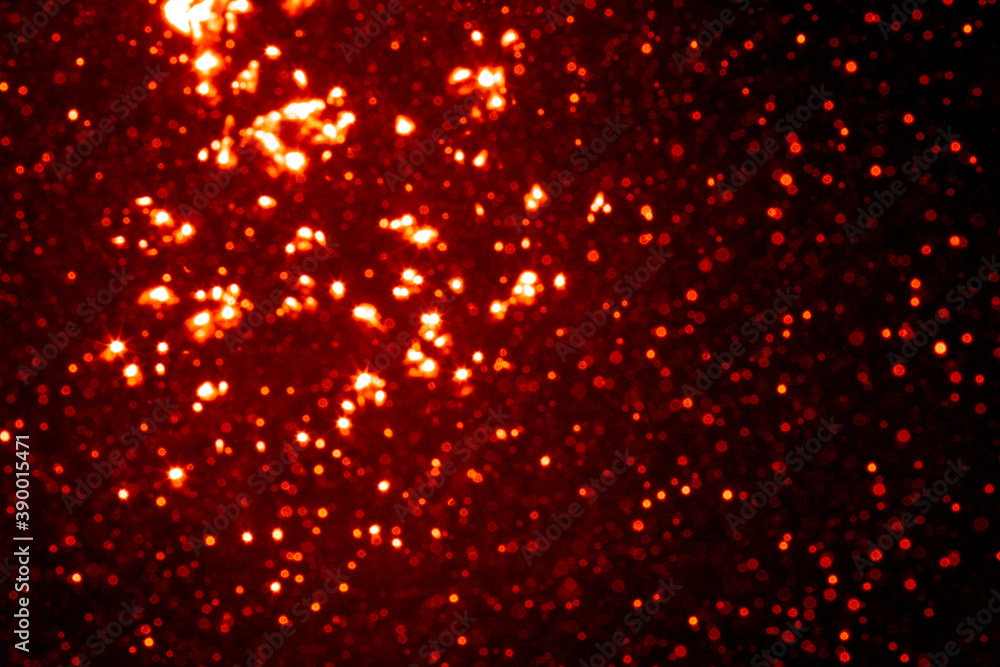 Red bokeh of light textured glitter background