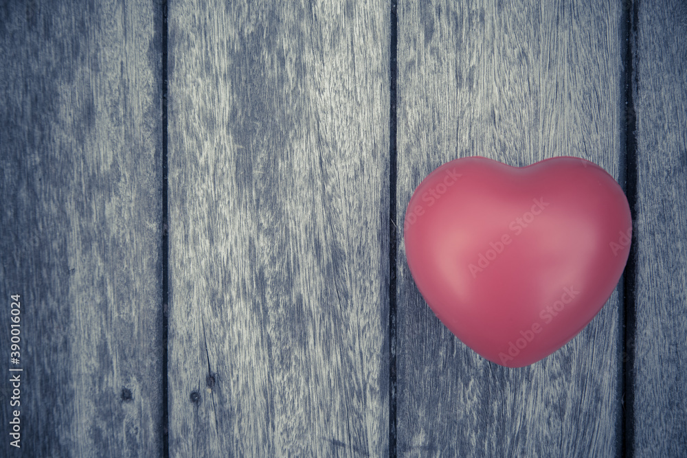 Red heart on wooden table Red heart on wooden table