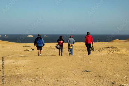 people walking on the beaches of Marcona