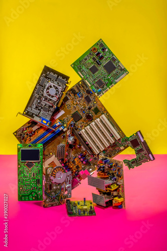 Abstract figure folded from computer circuit boards on a colored background photo