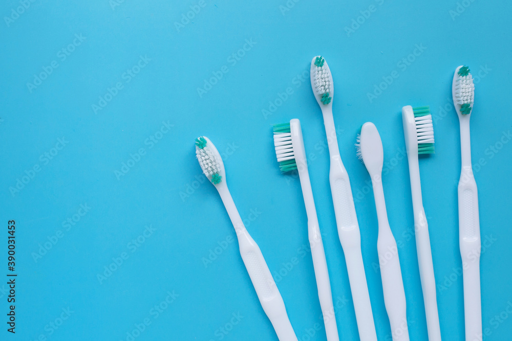 Toothbrushes on blue background. Top view Toothbrushes on blue background. Top view