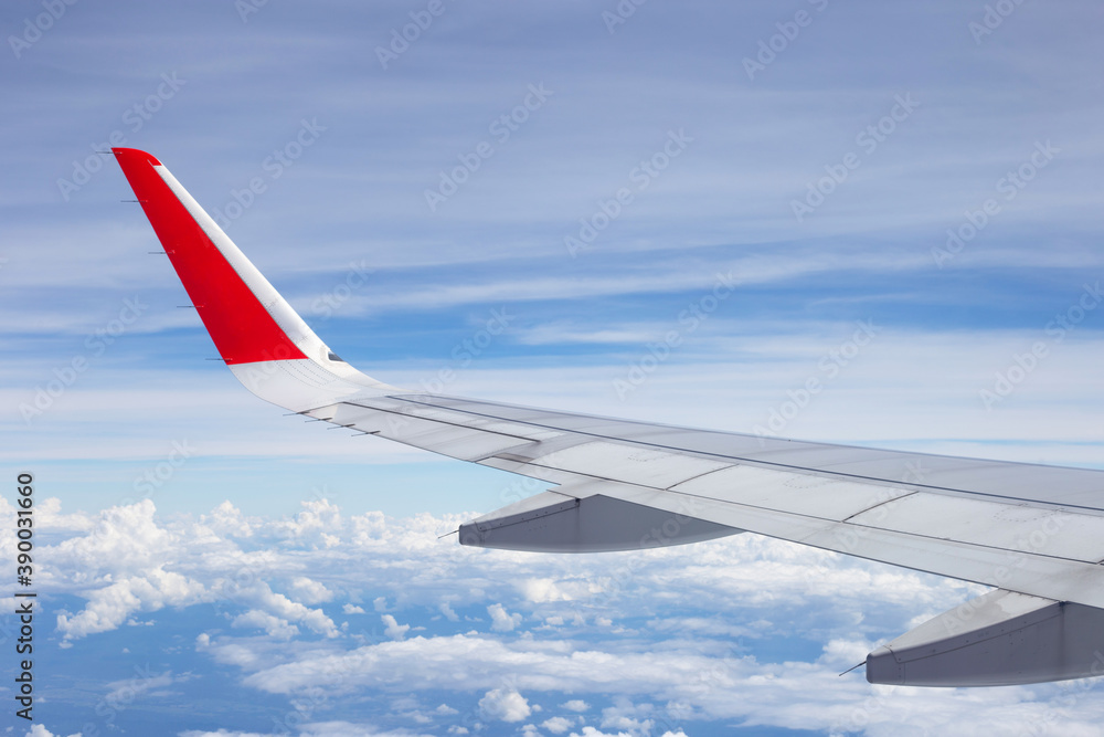 View of sky cloud and wing of airplane from window View of sky cloud and wing of airplane from window