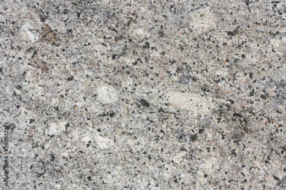Porphyritic granite surface. Intrusive igneous rock. Porphyritic granite surface. Intrusive igneous rock.