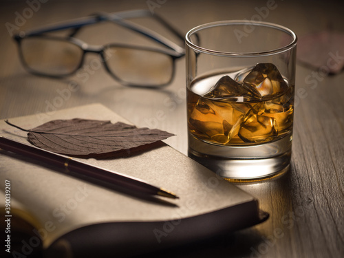 Backlit glass of whisky on the rocks