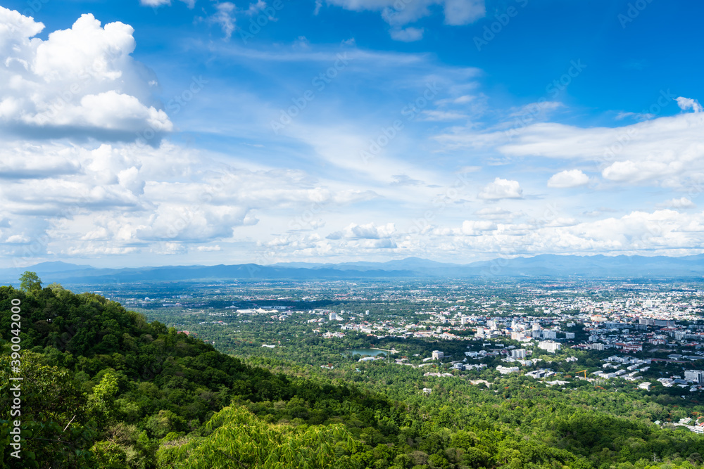 view in the mountains with cityscape over the city airatmosphere bright blue sky background abstract clear texture with white clouds. of Chiang Mai,Thailand view in the mountains with cityscape over the city airatmosphere bright blue sky background abstract clear texture with white clouds. of Chiang Mai,Thailand