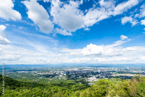 Fototapeta Naklejka Na Ścianę i Meble -  view in the mountains with cityscape over the city airatmosphere bright blue sky background abstract clear texture with white clouds. of Chiang Mai,Thailand