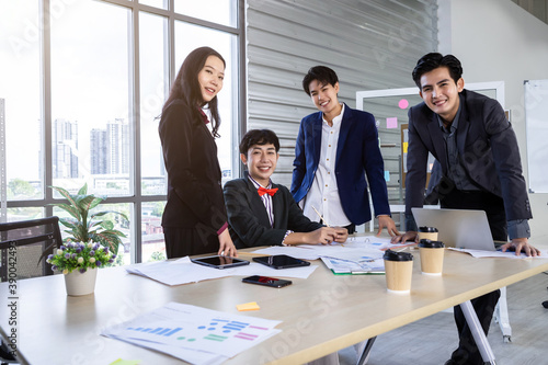 Successful happy workers Group of asian business people with diverse genders (LGBT) workers with in company workers Group of asian business people and support in the meeting room at office
