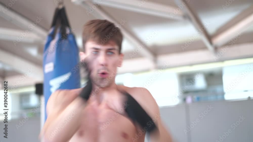 Fast Kickboxer training in gym Fast Kickboxer training in gym