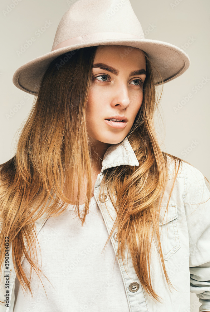 portrait of blond woman in hat and denim shirt portrait of blond woman in hat and denim shirt