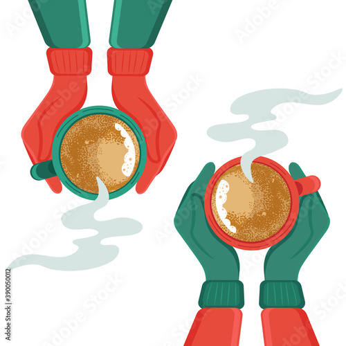 Two hands holding a cup of hot drink. Hands in mittens holding a cup of hot tea or coffee.
